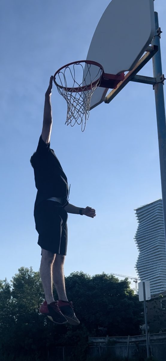 Ahmad Abu-Hattab playing basketball in Toronto — McMaster Engineering Physics student