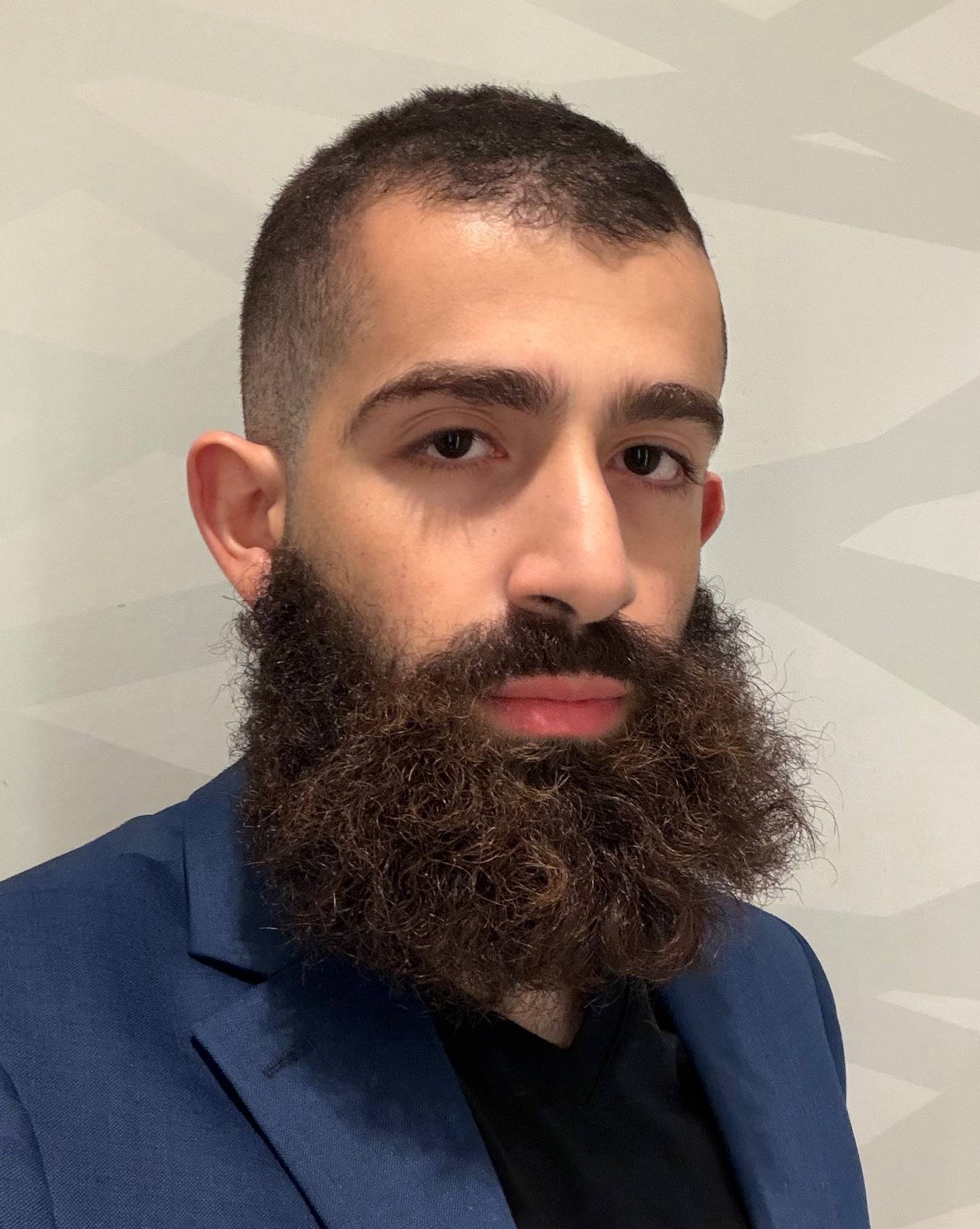 Ahmad Abu-Hattab — professional headshot. Engineering Physics student at McMaster University, CEO of City Centre Firm Corp, founding team member at Vosyn, and startup founder based in Toronto, Canada